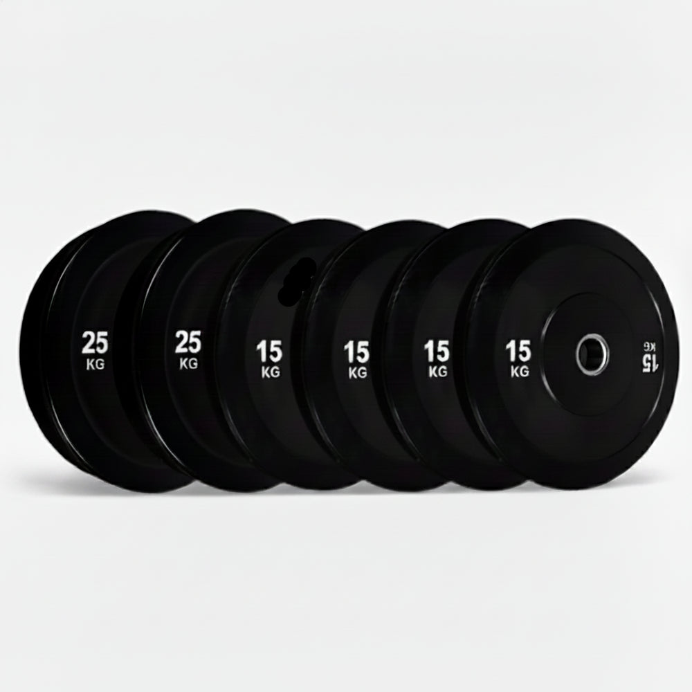 Set of black gym weight plates with weight markings on a white background