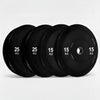 Set of black gym weight plates on a white background