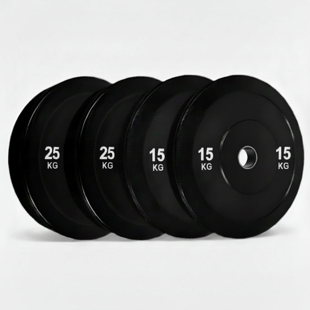 Set of black gym weight plates on a white background