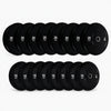 Set of black weight plates on a white background