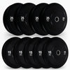 Set of black gym weight plates on a white background