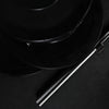 Stack of gym weight plates on a black background