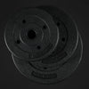 Two black weight plates stacked on a dark background