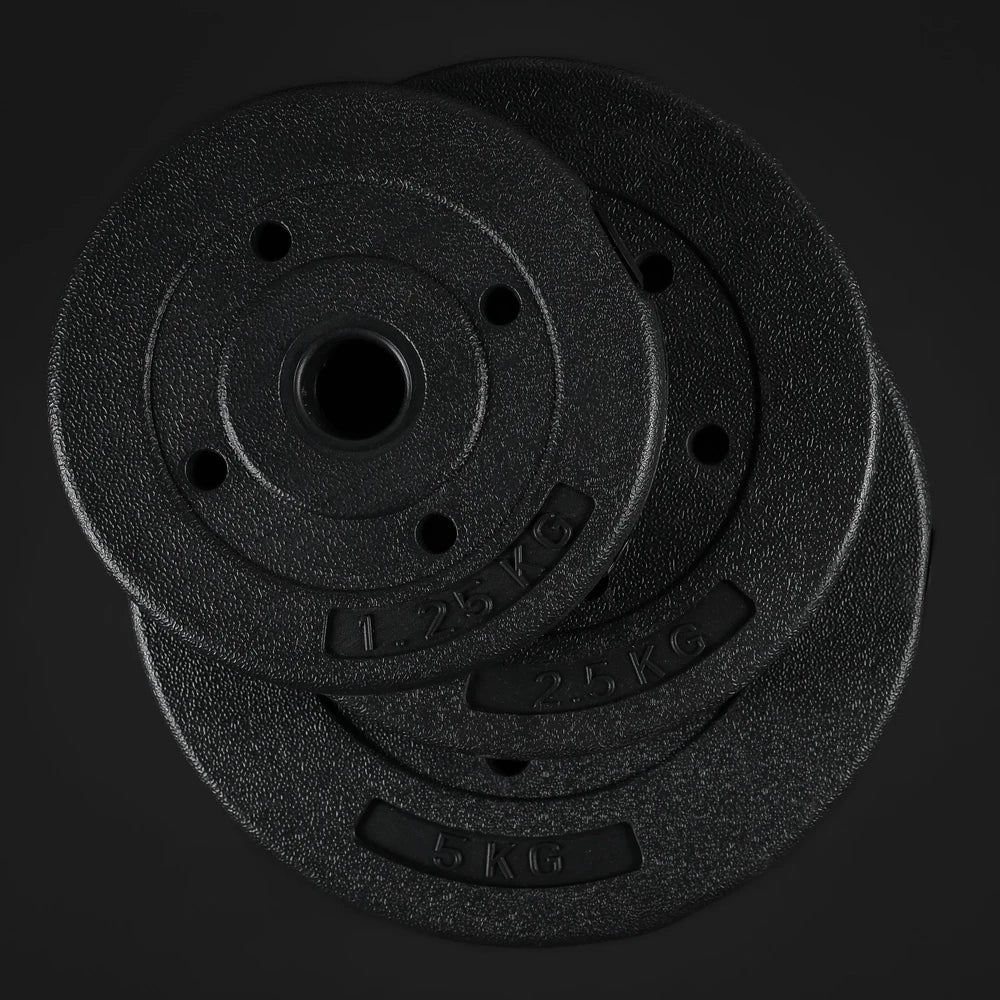 Two black weight plates stacked on a dark background