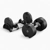 Pair of adjustable dumbbells on a white background