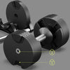 Pair of adjustable dumbbells on a gray background