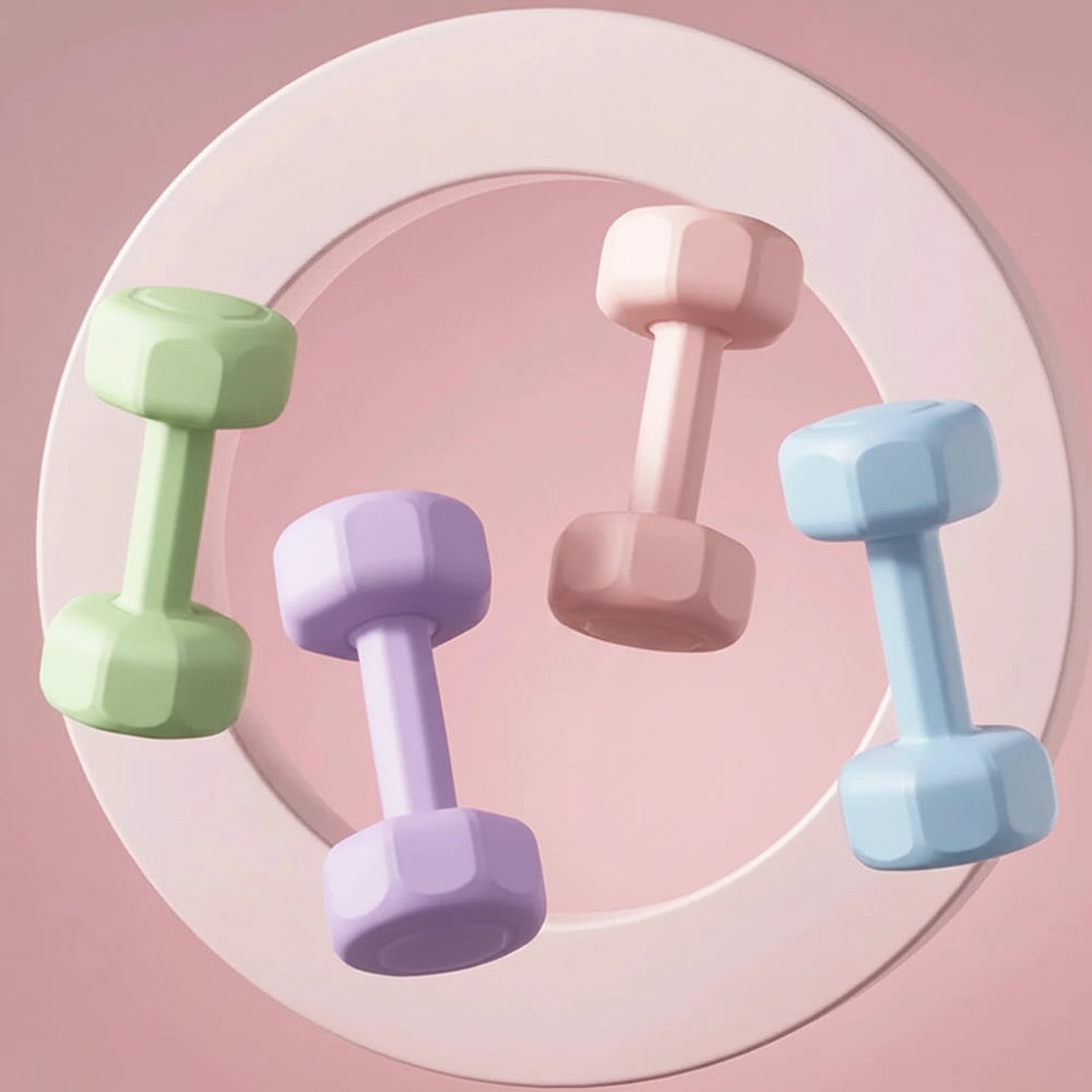 Set of colorful dumbbells on a pink background