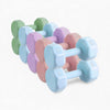 Set of colorful dumbbells on a white background