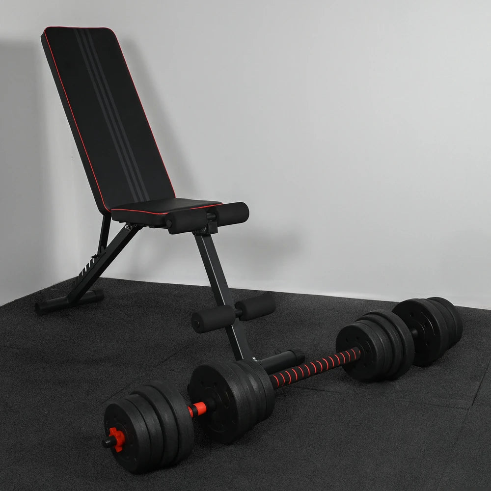 Black adjustable weight bench with dumbbells on a gray surface