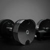 Three metallic objects with a reflective surface on a dark background