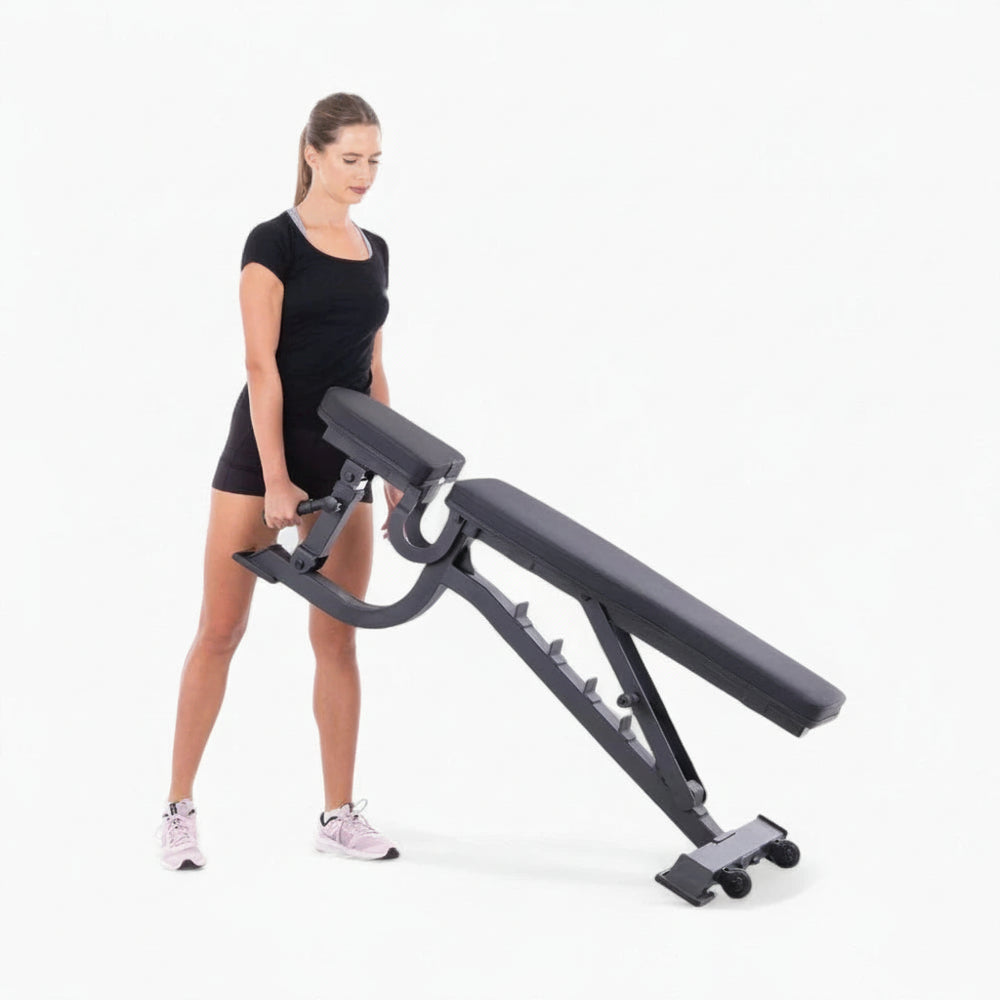 Woman using a black adjustable weight bench on a white background