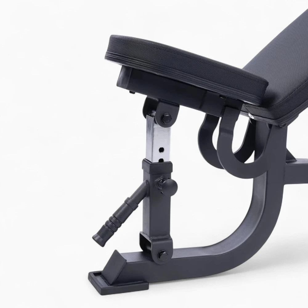 Black adjustable gym bench on a white background