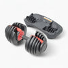 Pair of adjustable dumbbells with a charger on a white background