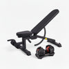 Black adjustable weight bench with dumbbells on a white background