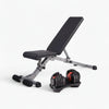 Adjustable weight bench with dumbbells on a white background