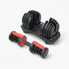 Set of adjustable dumbbells on a white background