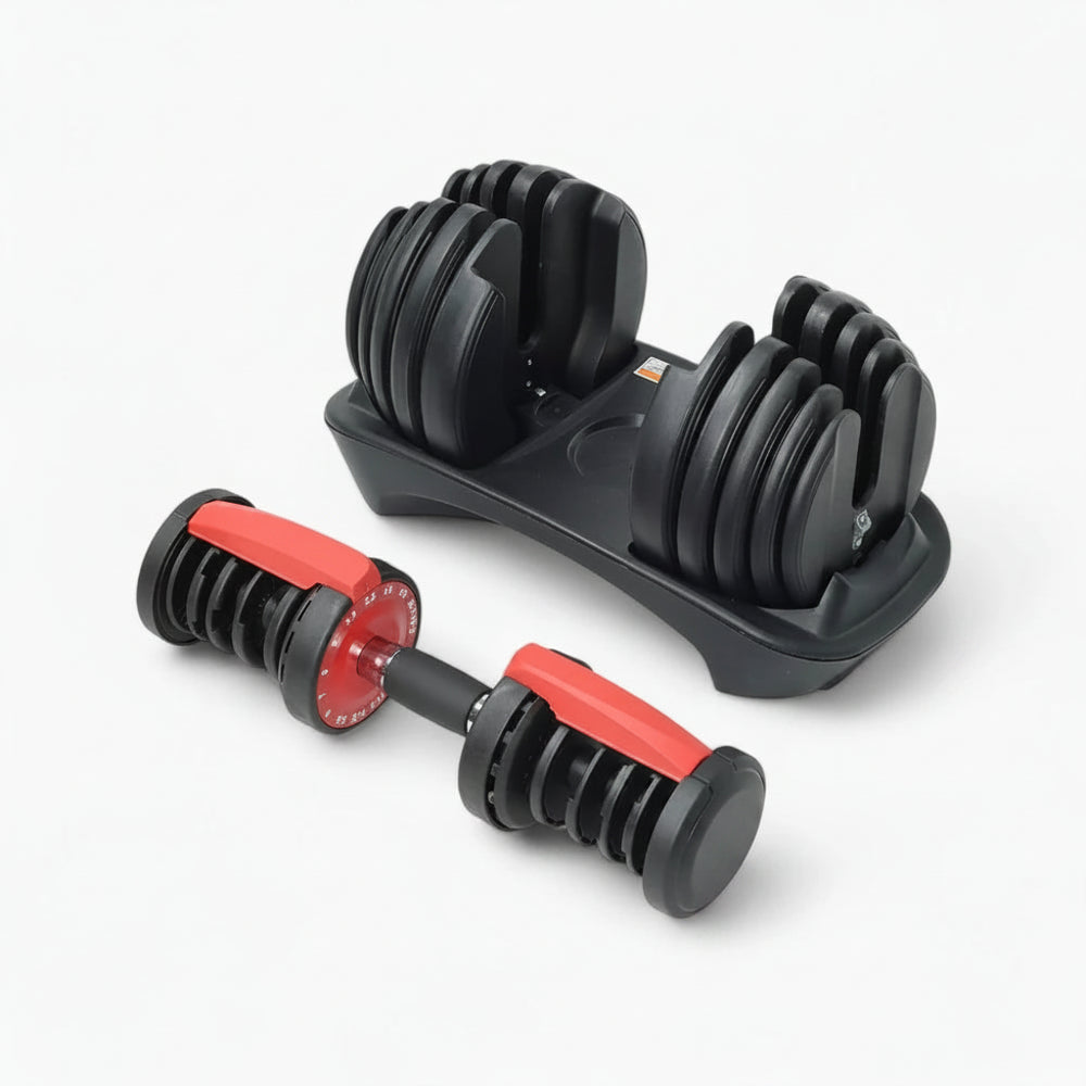 Set of adjustable dumbbells on a white background