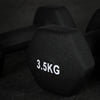 Black dumbbell with '3.5KG' marking on a dark background