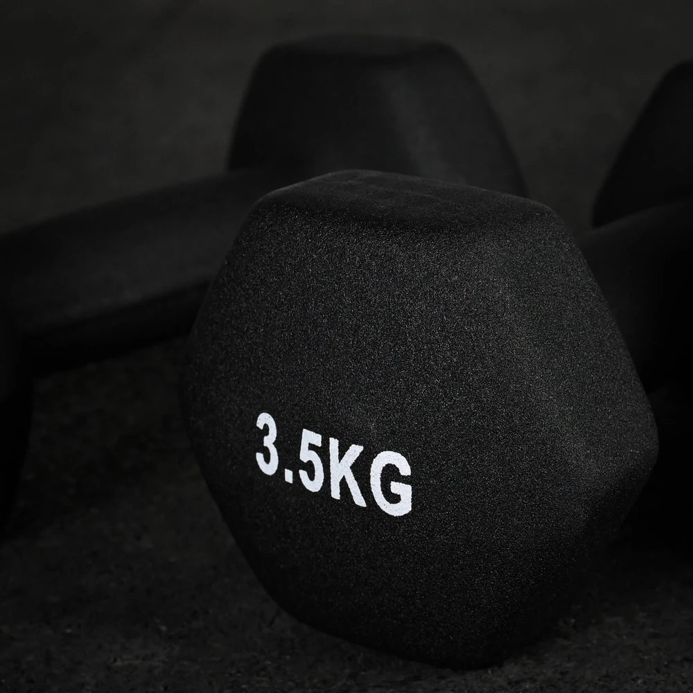 Black dumbbell with '3.5KG' marking on a dark background