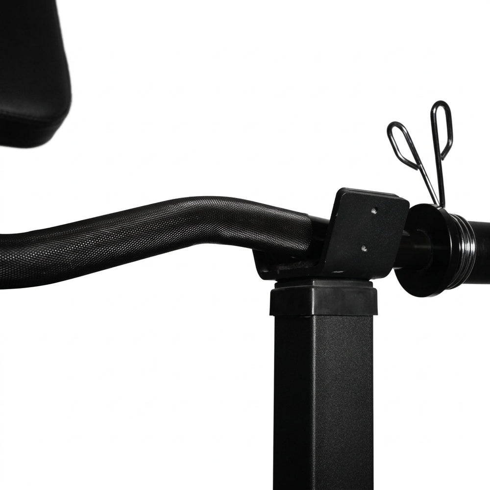 Barbell in holder on a preacher curl bench