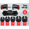 Adjustable dumbbells with weight attachments on a gray background