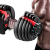 Adjustable dumbbells in black and red, shown with a person's hand gripping one and the other positioned near the torso, on a white background.