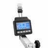 Digital rowing computer mounted on a rowing machine, showing a blue backlit LCD screen with metrics and controls, set against a plain white background.
