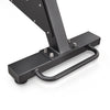 Close-up of a black metal gym equipment base with a curved hand grip and mounting bolts on a white background.