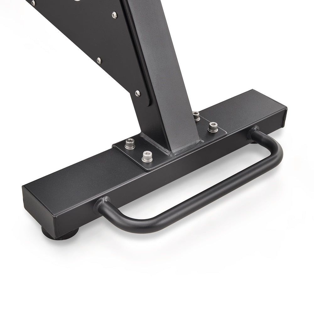 Close-up of a black metal gym equipment base with a curved hand grip and mounting bolts on a white background.