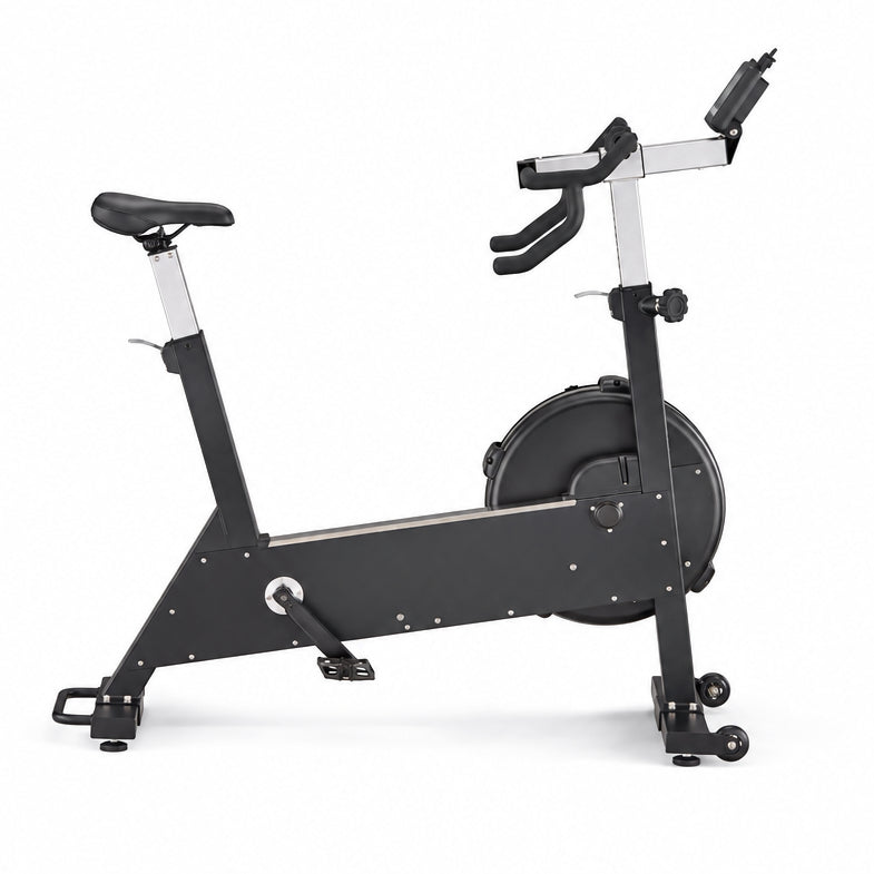 A black and silver indoor stationary exercise bike with a digital display on the handlebars, shown from a side profile on a white background.