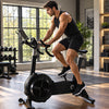 Man using an air resistance bike in a home gym setting