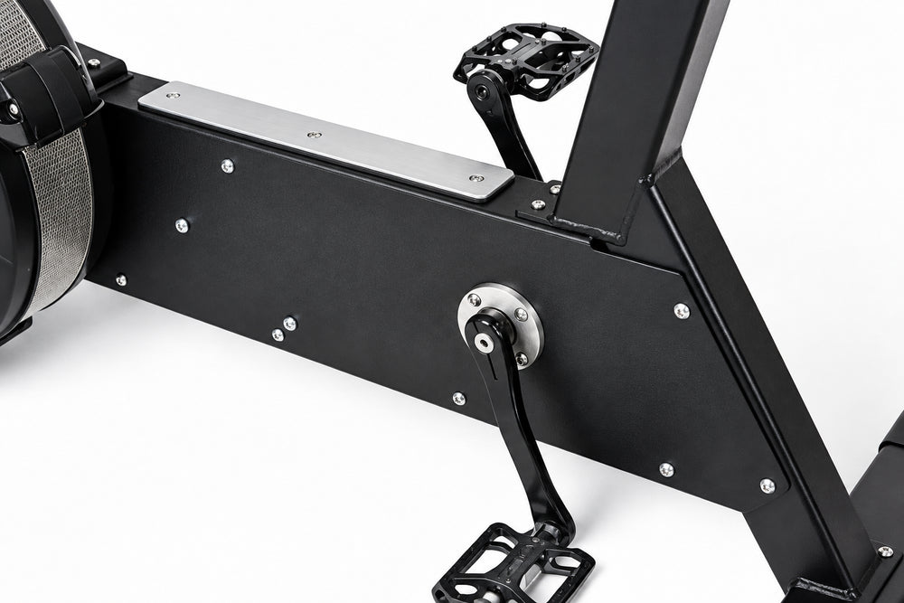 Close-up of a black exercise bike on a white background