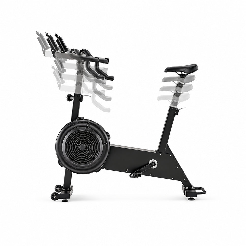 A black indoor cycling machine with a large front fan, black saddle, and multiple handlebar grips, shown on a clean white background.