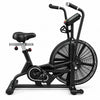 A black indoor stationary exercise bike with a large front fan, black seat, and handlebar with a small display screen, photographed on a clean white background.