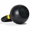 A black kettlebell with a yellow accent band, shown on a white background with the text 'Flat base and Back for Stability' above it.