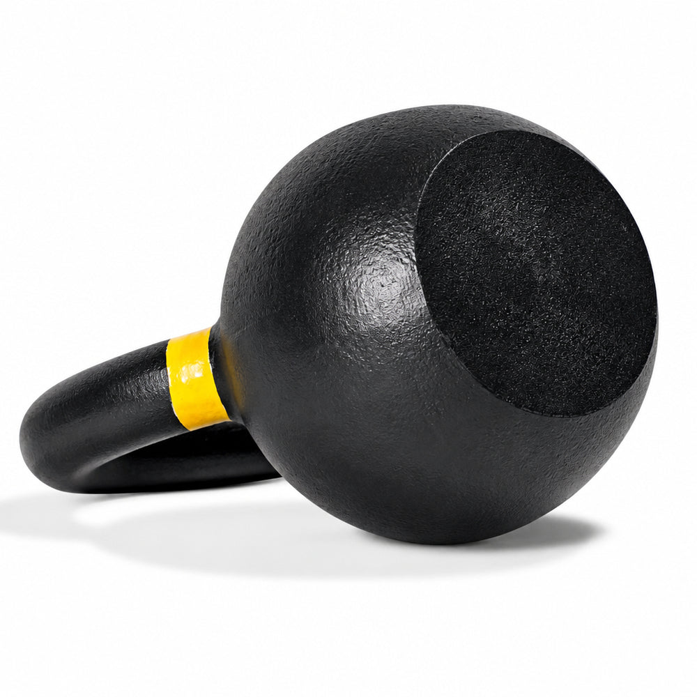 A black kettlebell with a yellow accent band, shown on a white background with the text 'Flat base and Back for Stability' above it.