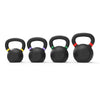 Four black kettlebells lined up in a row on a white background, each with a different colored ring accent on the handle (yellow, purple, green, and red).
