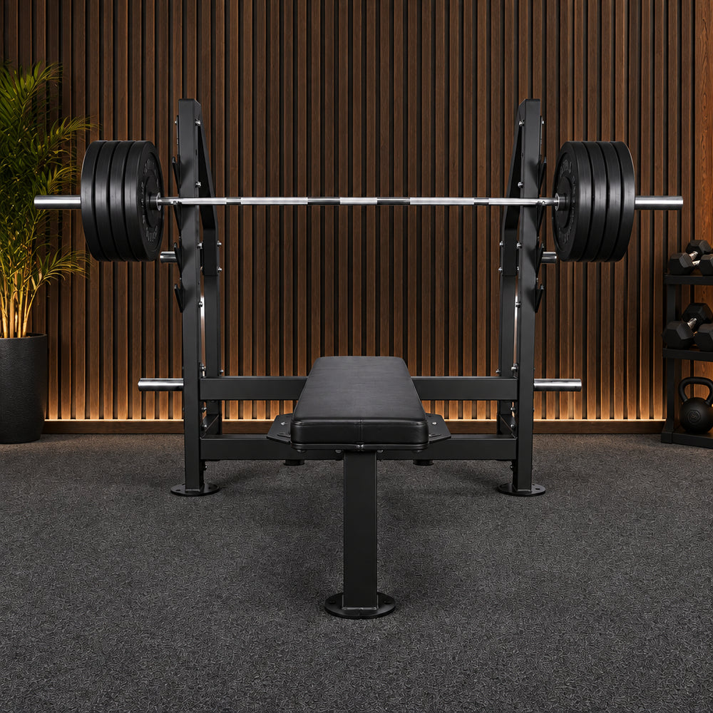 Gym flat weight bench with barbell on a white background