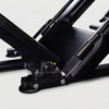 Close-up of a mechanical component of leg press on a white background
