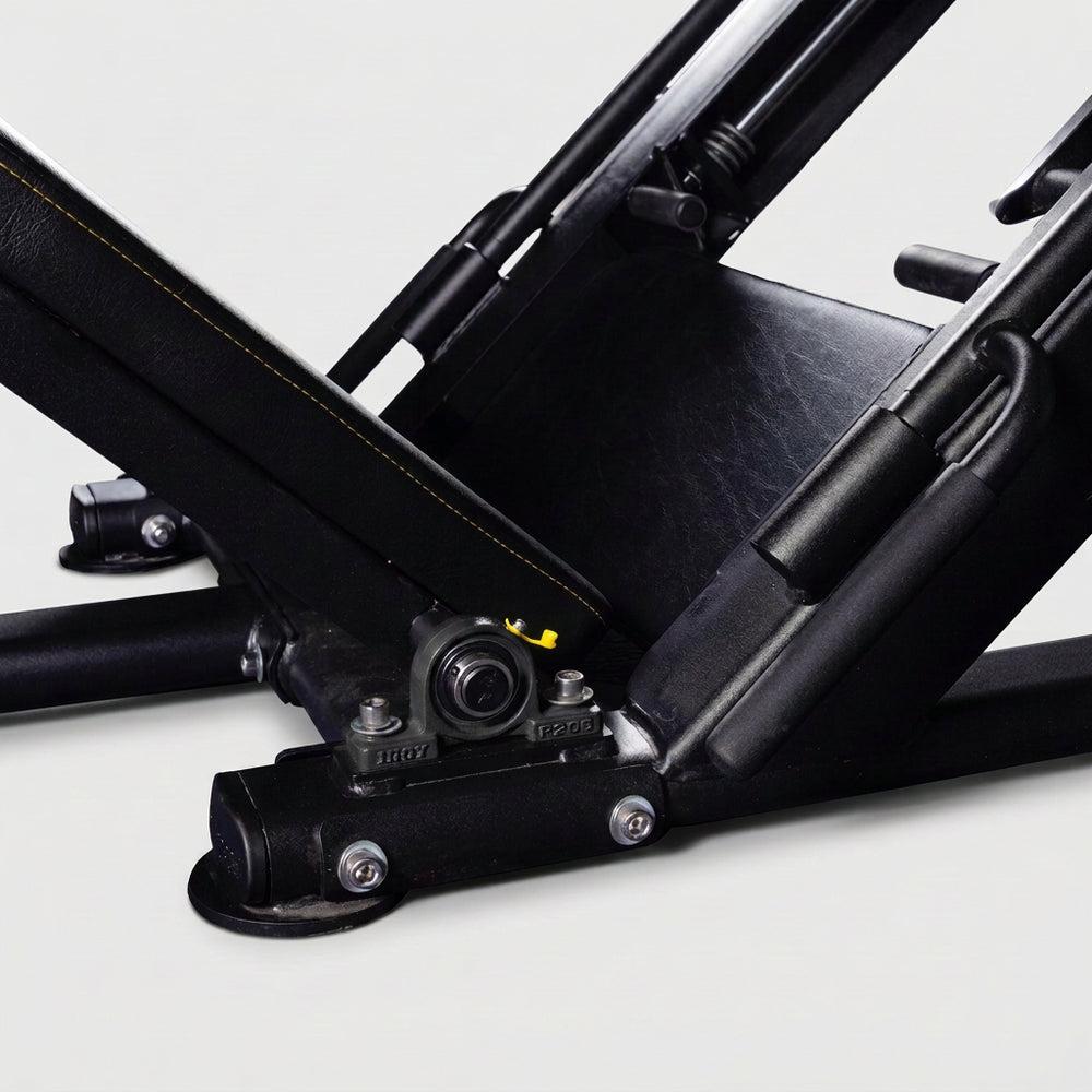 Close-up of a mechanical component of leg press on a white background