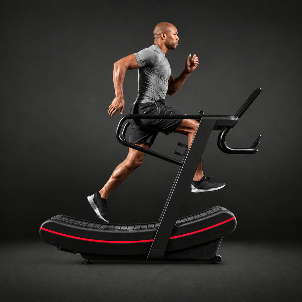 Man running on a treadmill against a dark background