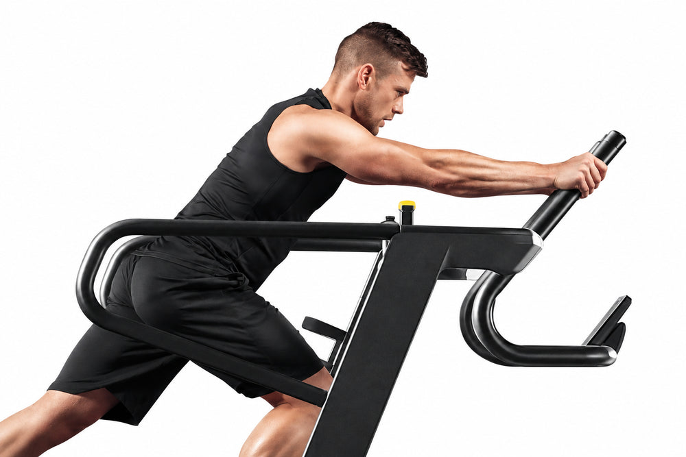 Man exercising on a stationary bike with a white background