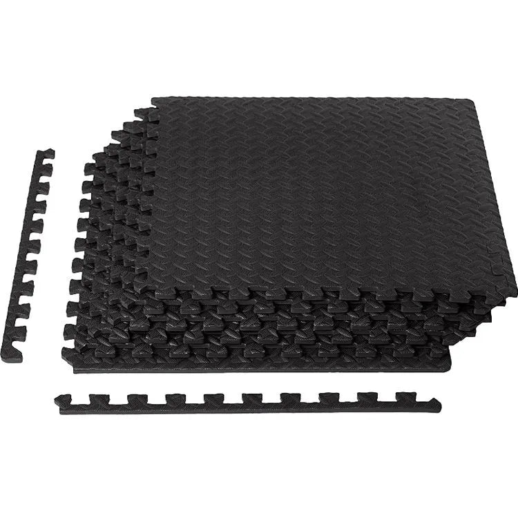 Black interlocking foam floor mats with a textured diamond pattern, shown with two loose connector pieces on a plain white background. Main image