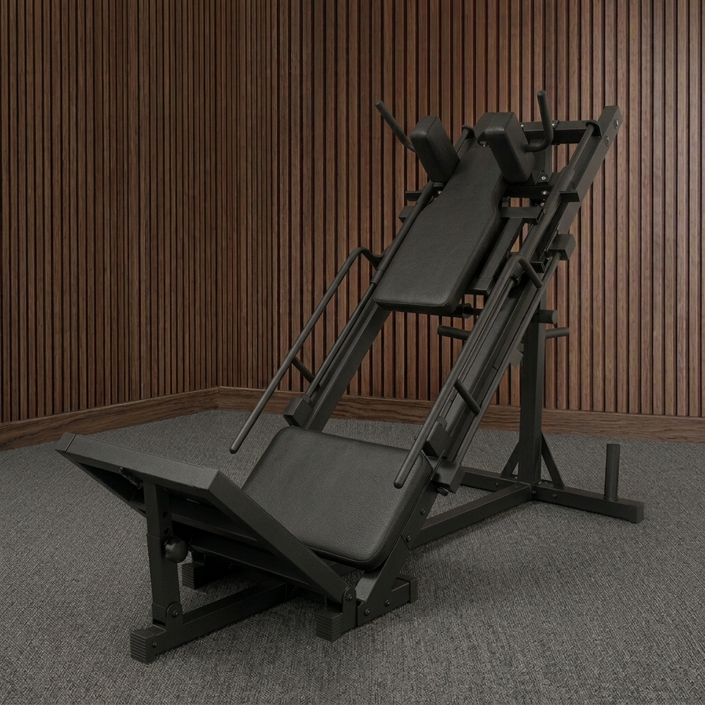 A black adjustable leg press machine in a home gym setting.