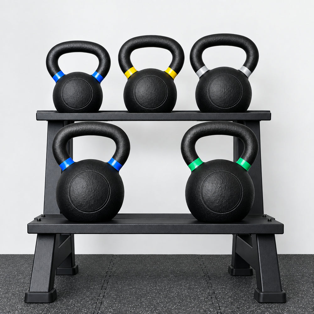 Set of kettlebells on a rack with a white background