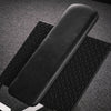 Black textured foot rest of a leg press