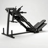 A black industrial leg extension gym machine with a foot platform and adjustable frame.