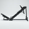 A black adjustable leg extension machine shown from a side profile
