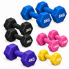 Mixed Colour dumbbells scattered on a dark surface