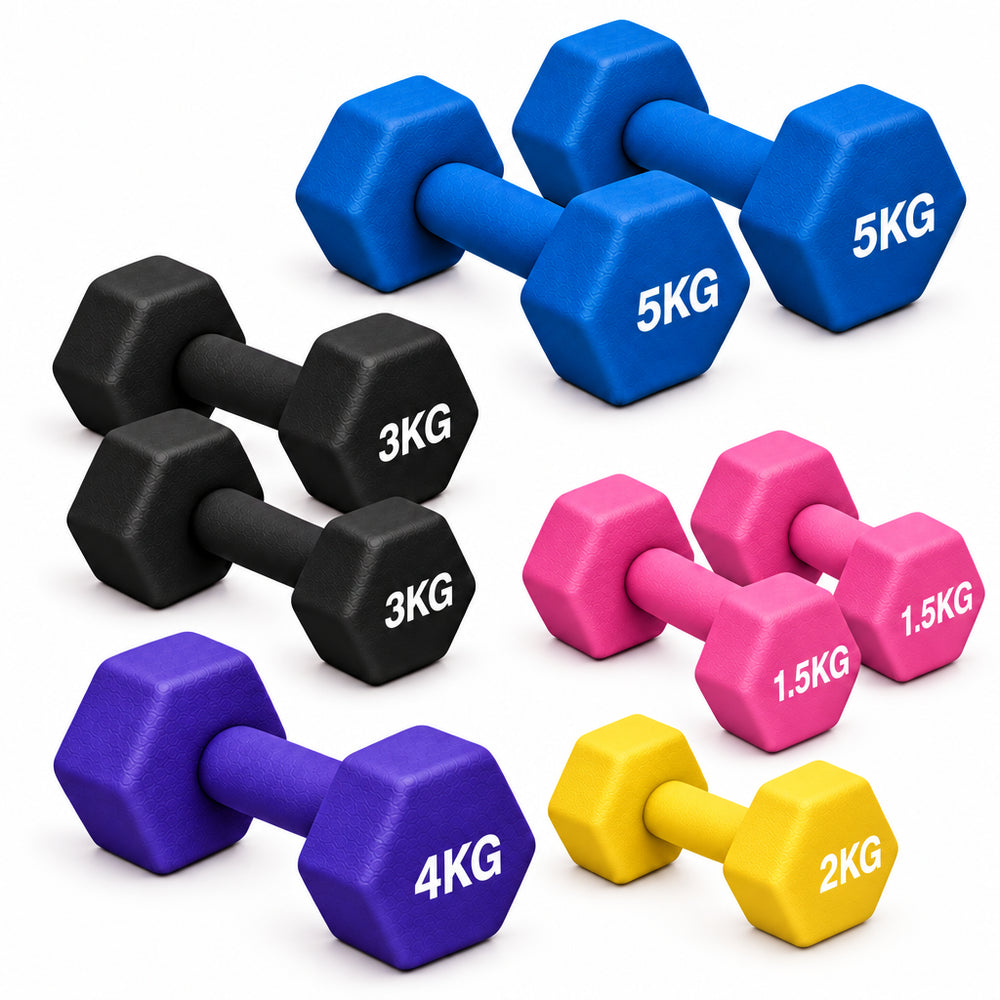 Mixed Colour dumbbells scattered on a dark surface